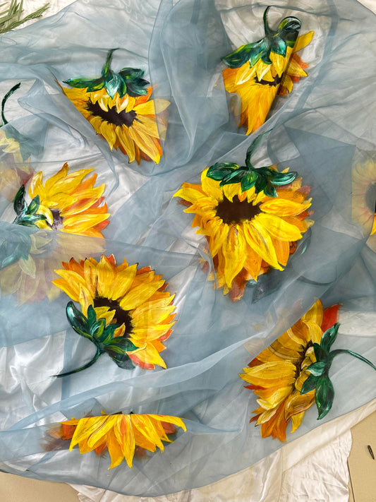 Close view of Mukhi sky blue organza dupatta featuring hand painted sunflower design