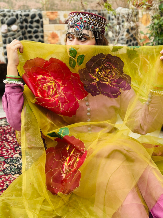 Model wearing Ghulaab hand painted yellow organza dupatta with large red and maroon floral rose design