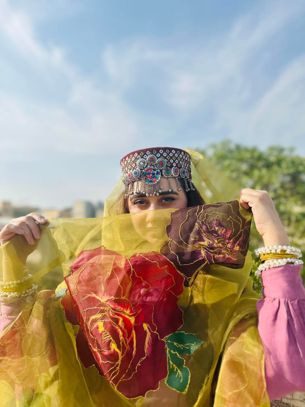 Woman styling Ghulaab yellow hand painted organza dupatta with bold floral rose artwork