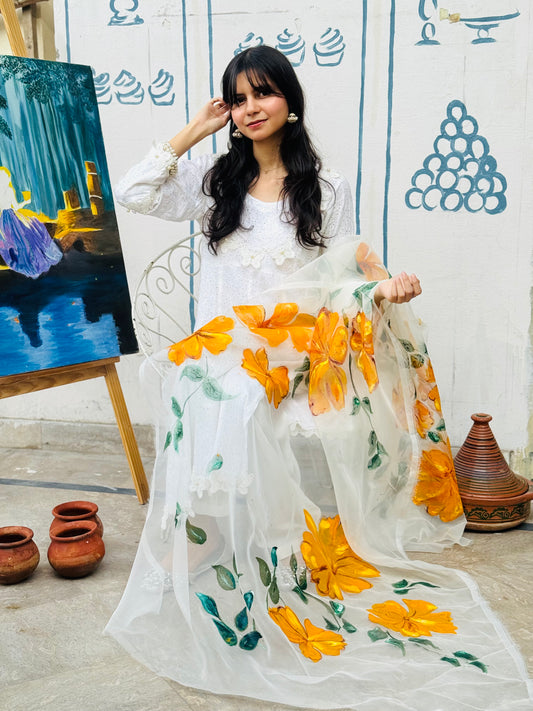 Model wearing Mehr hand painted white organza dupatta with yellow floral design and green leafy details